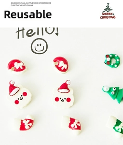 Detailed view of resin Christmas stud earrings featuring pine trees, bears and boots