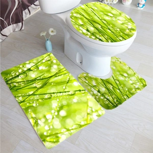 Detail view of 3-piece bathroom mat set with vibrant green grass and dewdrop pattern