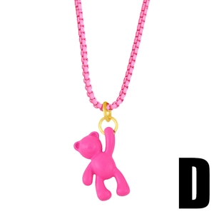 Close-up of Barbie pink Y2K 3D teddy bear pendant with golden clip on box chain