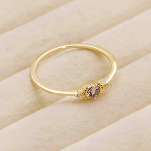 Close-up of S925 silver tanzanite ring with round purple gemstone and diamond accents