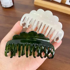 Set of two wavy cloud hair claws in pearl white and translucent green resin
