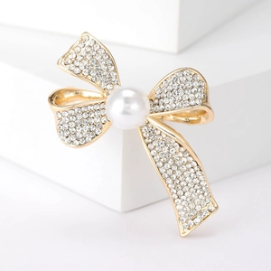 Elegant gold bow brooch with a large white pearl and sparkling rhinestones for women