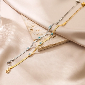 Evil eye snake chain bracelet in gold and silver finish with heart pendant