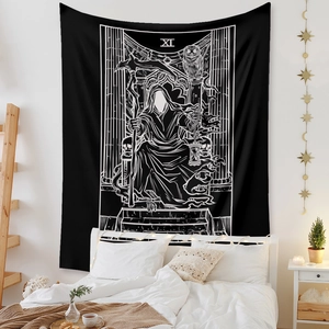 Detail of minimalist Death Tarot tapestry with owl and skull motifs hanging over a bed