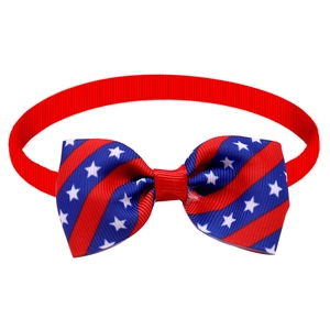 Detail of USA flag pet bowtie with red adjustable strap and grosgrain ribbon texture