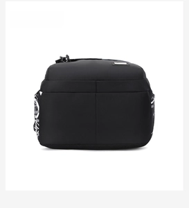 Detailed bottom view of black nylon backpack featuring durable fabric and side prints