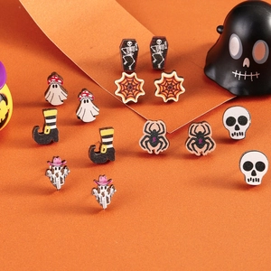 Halloween earring set with ghost, skull, and spider patterns on orange background