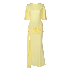 Detail of light yellow maxi dress featuring side pleats and elegant long ribbon streamers
