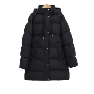 Women's black hooded long puffer jacket with gold metal buttons on a wooden hanger