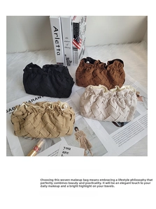 Detail view of corduroy makeup bags with pearl zipper sliders in four neutral colors