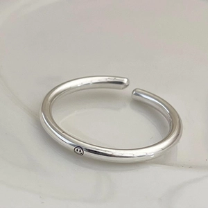 Minimalist 925 sterling silver open smile ring with a polished circular tube band