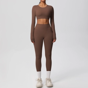 Two-piece coffee brown seamless yoga set featuring long sleeve crop top and high waist leggings