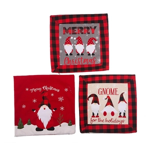 Three-piece Christmas gnome pillow covers with red buffalo plaid borders on white background