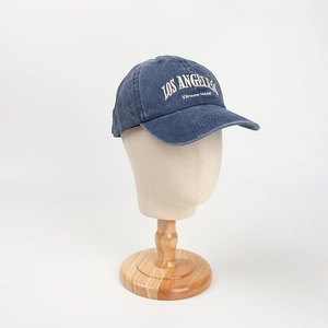 Detailed close-up of Los Angeles vintage embroidery on a navy washed cotton baseball cap