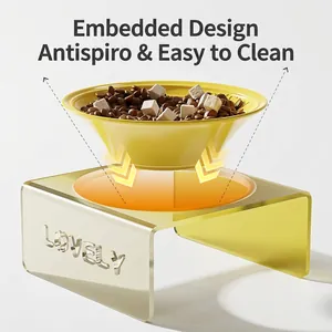 Modern ceramic cat bowl with yellow acrylic stand featuring non-slip U-shaped design