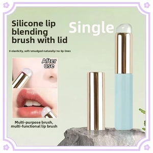 Detail of round silicone lip brush with cover for smudge lipstick and concealer application