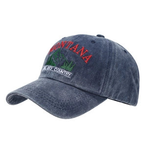 Washed navy baseball cap featuring Montana mountain embroidery and curved brim style