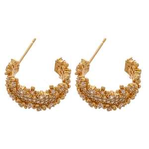Gold metallic C-shaped earrings with pavé zircon floral pattern on white background