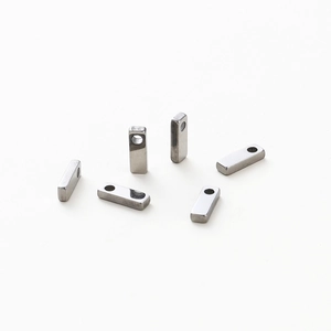 Macro shot of silver rectangular alphabet beads with 1.8mm hole for jewelry making