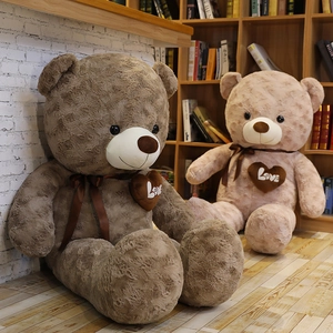 Detailed view of rose-pattern plush teddy bears in dark brown and soft pink colors