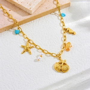 Gold-plated ocean theme necklace with starfish shell charms and blue heart beads