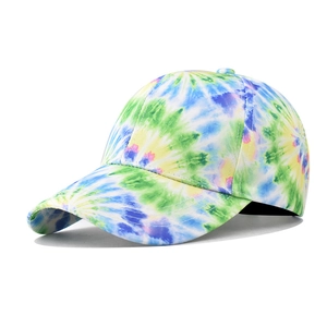Detail shot of colorful tie-dye patterns and texture on a cotton baseball cap