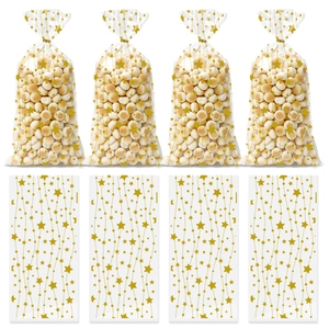 Detail of transparent gift bags with gold star patterns filled with small cookies