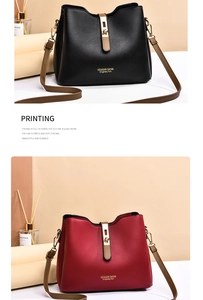 Detail of elegant black and burgundy contrast shoulder bags with metallic gold hardware