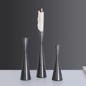 Set of three Nordic minimalist gunmetal iron candlesticks with a sleek brushed metal finish