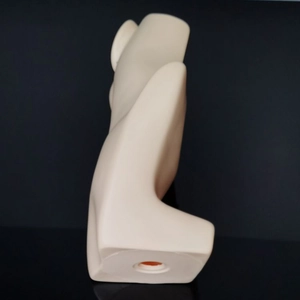 Detailed side profile of beige PVC mannequin head for showing necklaces and earrings
