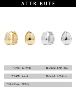 Macro shot of minimalist s925 sterling silver drop-shaped earrings in gold and silver