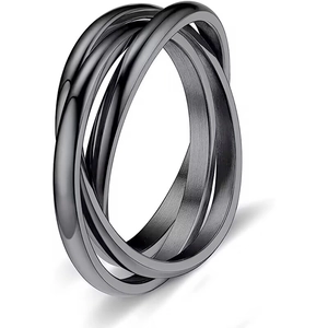 Macro detail of black brushed titanium steel interlocking triple band spinning ring