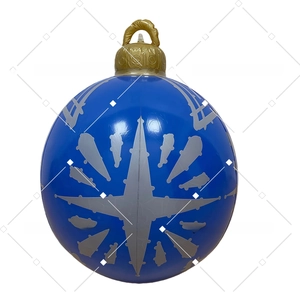 Close-up of blue inflatable Christmas ball with silver star pattern and golden top cap