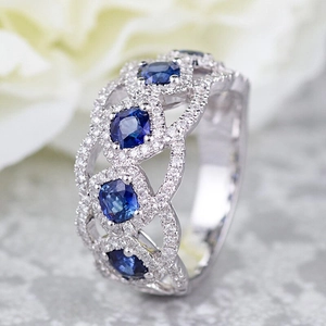 Elegant silver ring with blue sapphire gemstone and hollow micro-set pavé diamonds