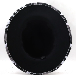 Detail view of the camouflage fedora hat interior showing the 65% cotton fabric label