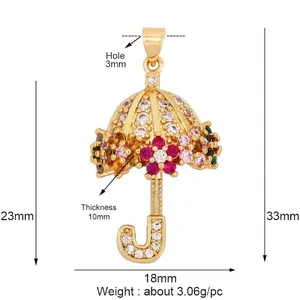 Pendentif parapluie doré avec cristaux scintillants et fleurs de pierres précieuses