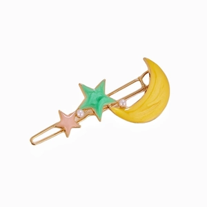 Elegant gold hair clip with moon, stars, and pearls design for a stylish women look