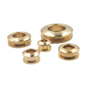 Polished golden brass grommet eyelets in five various sizes for leather bags and apparel