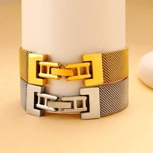 Detailed view of mesh bracelet straps in gold and silver with elegant metal texture