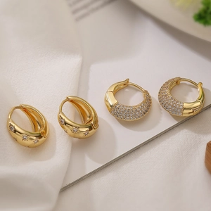 Chic 18K gold plated zircon geometric hoop earrings with starburst pattern on white fabric