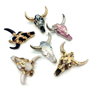 Set of six bull skull acrylic pendants with assorted colors and bohemian textures