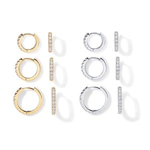 Detail view of gold and silver hoop earrings featuring micro-pave cubic zirconia stones