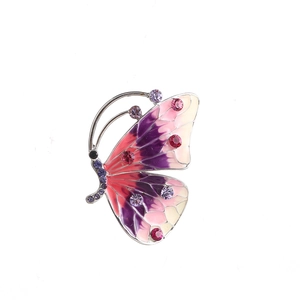 Macro shot of gradient enamel butterfly brooch with inlaid purple rhinestones