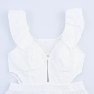 White sleeveless dress featuring hollow-out details and ruffled butterfly sleeve design