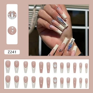 Long coffin press on nails with French tip design and 3D rhinestones with pearls