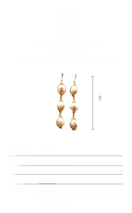 Detail view of 925 silver 18K gold plated wire wrapped triple natural pearl drop earrings