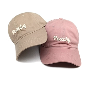 Pair of khaki and pink cotton baseball caps with Peachy 3D embroidery detail