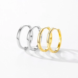 Polished S925 sterling silver hoop earrings in gold and silver finishes on white background