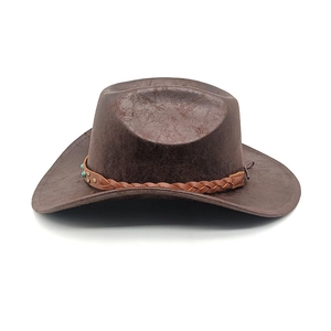 Close-up of brown western cowboy hat with cracked texture leather and turquoise studs