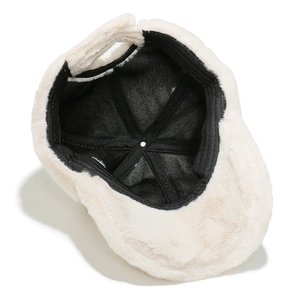 Detailed interior of winter plush baseball cap showing thick faux rabbit fur and lining